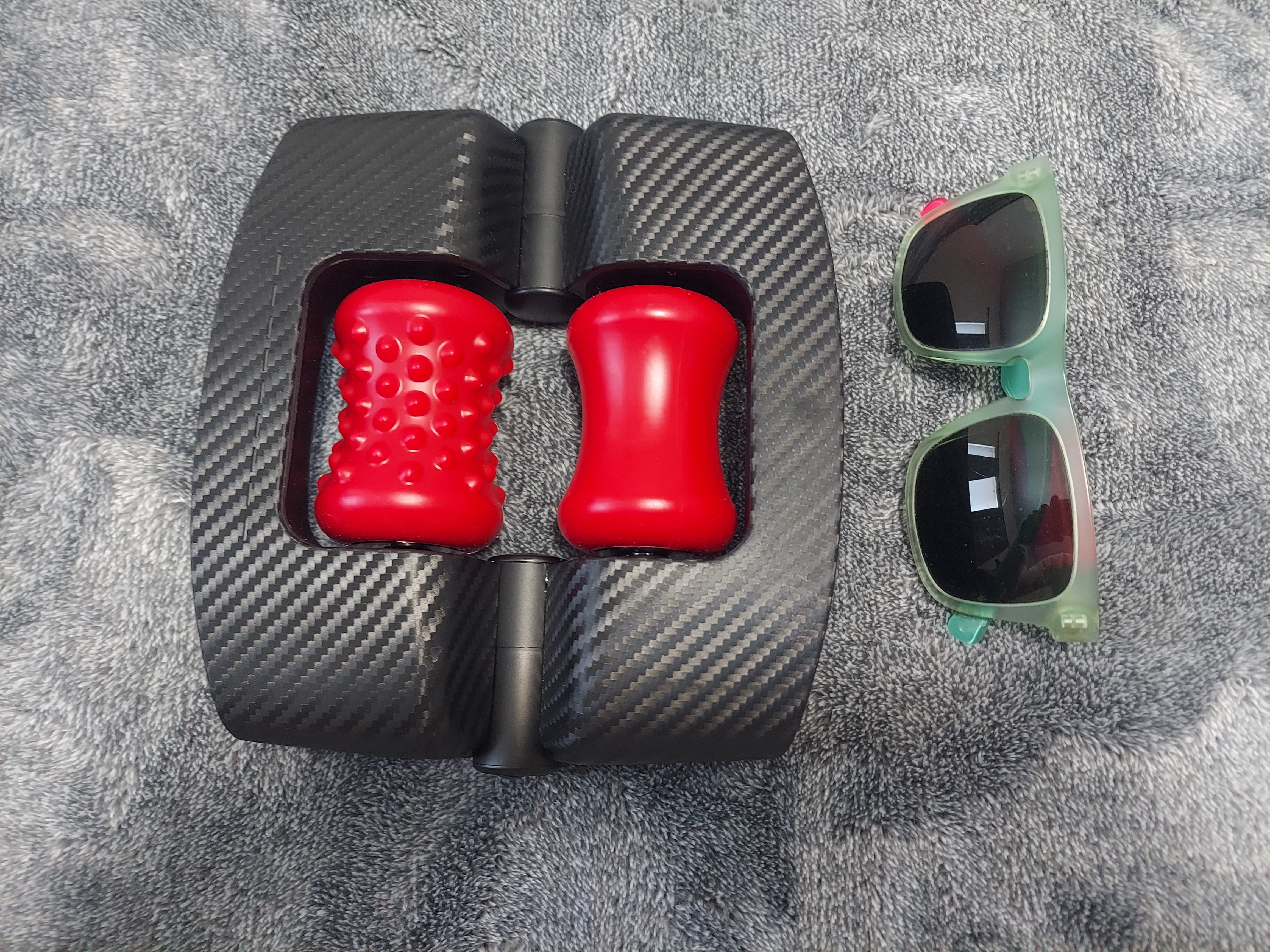 Size comparison of luxury Orctan sex toy and sunglasses